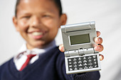 “Holding a calculator Santosh Chettri orphan at the Rainbow Children&#39;s home Pokhara Nepal” - - B7EN33